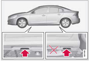 If a garage jack is used to lift the vehicle, the two jack attachments points