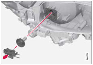 1. Remove the headlight housing from the vehicle (see page 306).