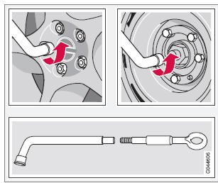 6. With the vehicle still on the ground, use the lug wrench/towing eyelet to